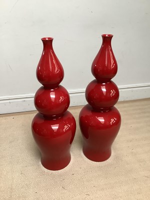 Lot 1248 - A pair of contemporary red lacquered triple...