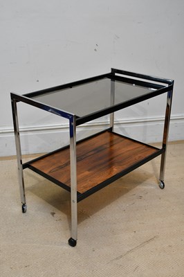 Lot 8 - HOWARD MILLER; a retro chrome two tier trolley...