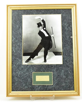 Lot 1626 - FRED ASTAIRE; a framed display featuring a...