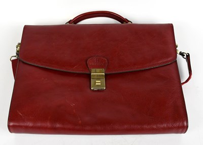 Lot 712 - HEXAGONA; a red leather briefcase with top...