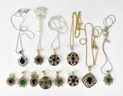 Lot 645 - A collection of Indian silver pendants set...