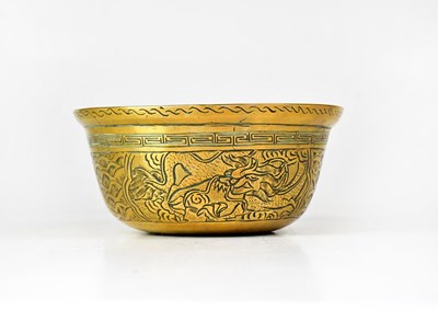 Lot 303 - A Chinese brass bowl with etched design of a...