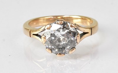 Lot 605 - A yellow metal solitaire ring, the brilliant...