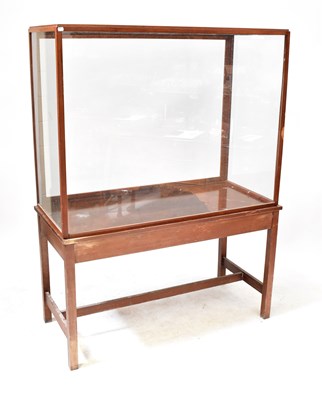 Lot 68 - A large wood and glass display case, on table...