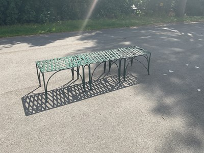 Lot 1271 - A green painted cast iron garden bench, length...