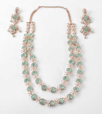 Lot 1277 - A gold plated two strand white and...