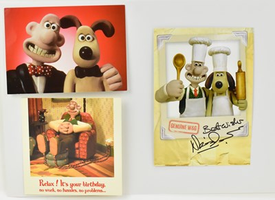 Lot 1663 - WALLACE & GROMIT; a display of three cards...