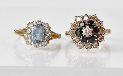 Lot 618 - Two 9ct gold rings set with white and blue...