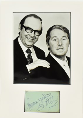 Lot 1643 - MORECAMBE & WISE; a display featuring a black...