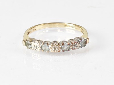 Lot 610 - A 9ct gold ring set with white stones, marked...