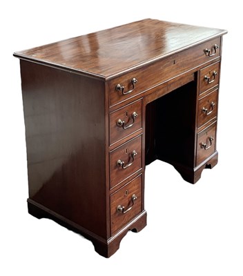 Lot 23 - A 19th century mahogany kneehole desk, with...