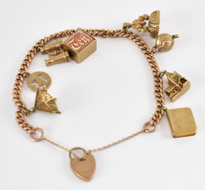 Lot 1240 - A 9ct yellow gold charm bracelet, approx 28.7g.