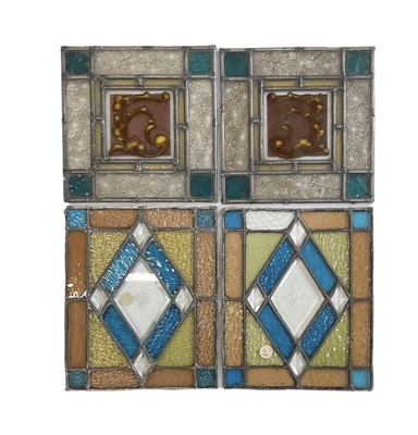 Lot 390 - A pair of blue, orange and yellow stained...