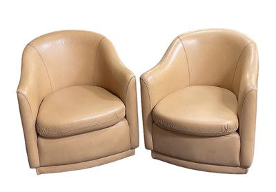 Lot 75 - A pair of modern tan leather upholstered...