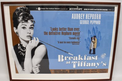 Lot 258 - FILM INTEREST; a Breakfast at Tiffany's poster,...