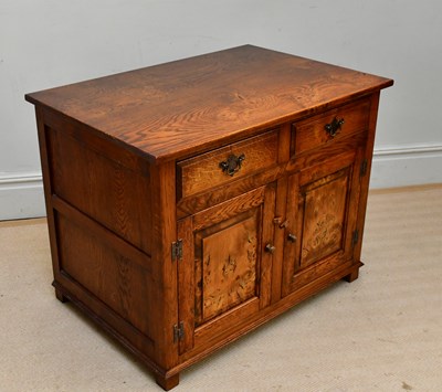 Lot 42 - A reproduction oak and willow side cupboard...