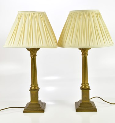 Lot 616 - A pair of modern brass Corinthian column table...