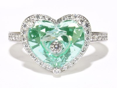 Lot 1017 - CHOPARD; an 18ct white gold, green stone and...