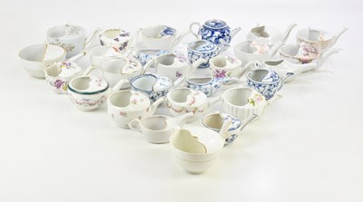 Lot 898 - A large collection of ceramic feeding cups,...