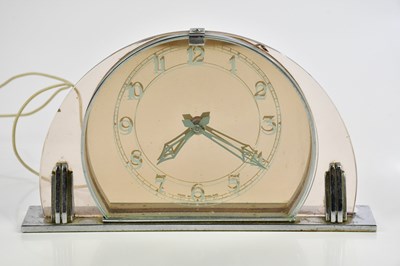 Lot 703 - An Art Deco chrome and glass mantel clock with...