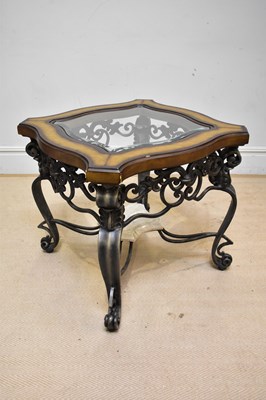 Lot 66 - A modern wrought iron framed glass top coffee...