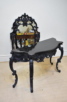 Lot 35 - A reproduction black marble topped serpentine...