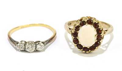 Lot 1108 - An 18ct yellow gold and diamond three stone...