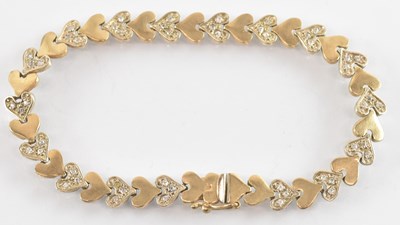 Lot 1285 - A 9ct yellow gold white stone set bracelet,...