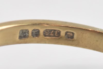 Lot 1354 - A 9ct yellow gold white stone set lozenge...