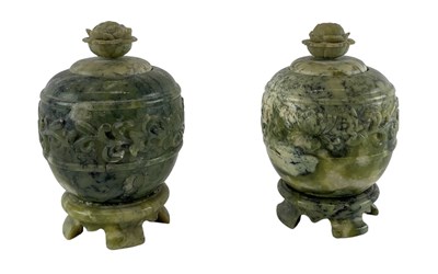 Lot 1068 - A pair of modern Chinese carved green...