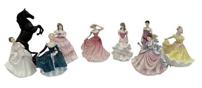 Lot 600 - ROYAL DOULTON; eight female figures comprising...