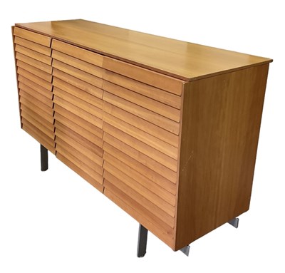 Lot 6 - PUNT MOBLES; a mid century light oak veneered...