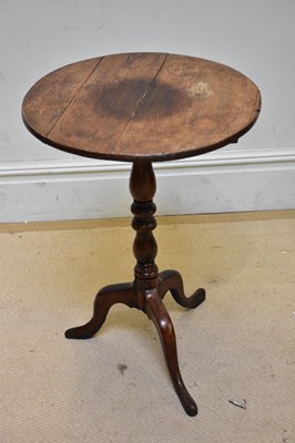 Lot 110 - A 19th century oak circular tilt-top...