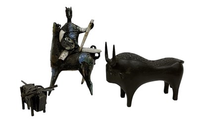 Lot 698 - A 20th century bronze model of a stylised bull,...