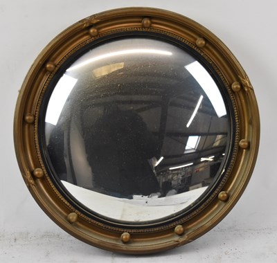 Lot 92 - A small 20th century gilt framed circular...