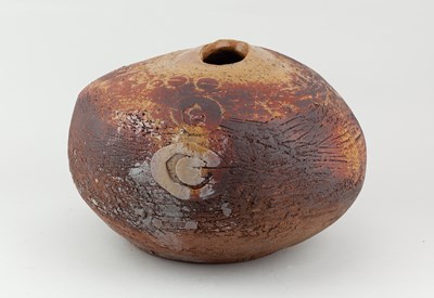 Lot 725 - A large stoneware pebble form covered in ochre...