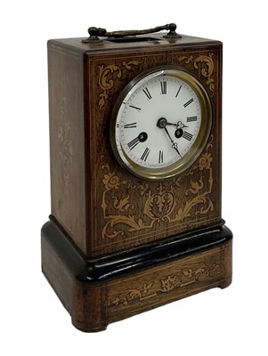 Lot 137 - A 19th century rosewood and inlaid clock, the...