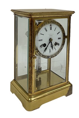 Lot 138 - A French brass and enamel cased clock with...