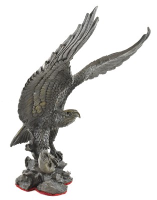 Lot 697 - A modern bronze figure of a perched eagle,...