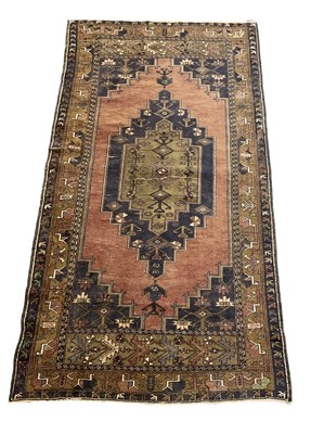 Lot 117 - A large handwoven carpet with geometric design,...