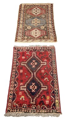 Lot 122 - A red ground rug with geometric design, 140 x...