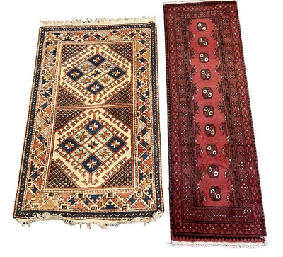 Lot 120 - A Persian style red ground runner with...