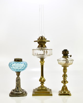 Lot 622 - Two brass oil lamps, with clear glass...