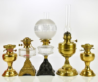 Lot 624 - A pair of brass oil lamps, with an Art Deco...