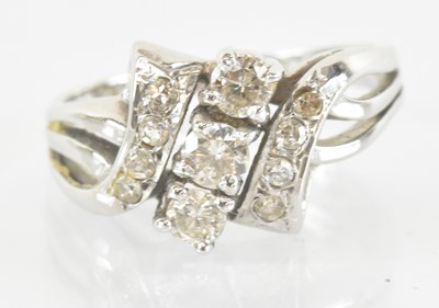 Lot 1250 - An 18ct white gold three stone diamond...