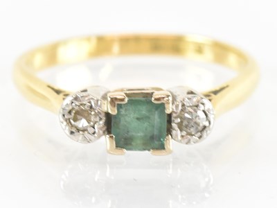 Lot 1259 - An 18ct yellow gold and platinum three stone...