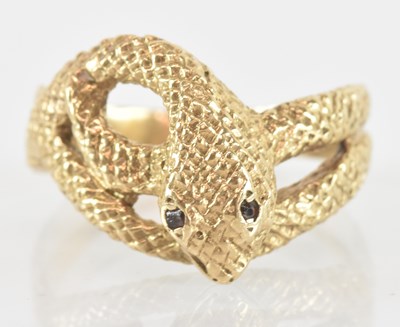 Lot 1294 - A 9ct yellow gold ring modelled a snake, the...