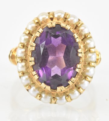 Lot 1254 - A 14ct yellow gold amethyst and pearl set ring,...