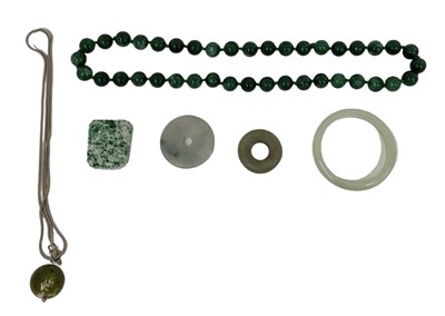 Lot 1333 - A group of jade and green hardstone jewellery...