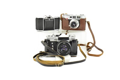 Lot 183 - Three vintage cameras, comprising a Zenit EM...